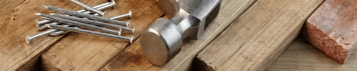 Hammer and nails on hardwood flooring boards in Honolulu, HI