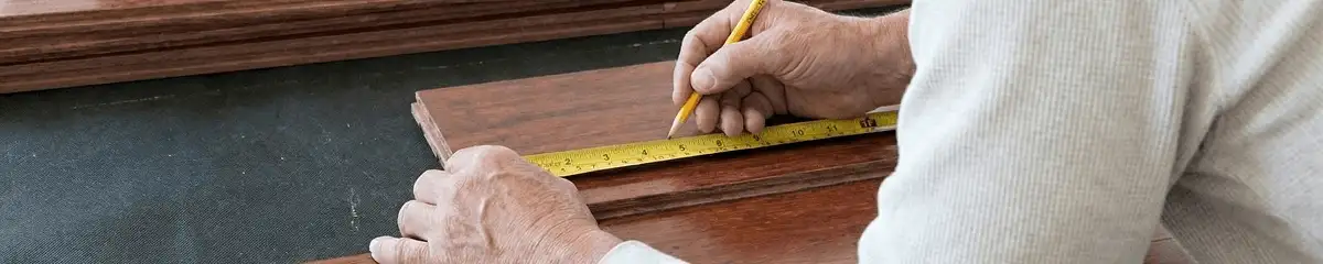 A professional installing wood flooring in Honolulu, HI